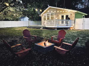 Back yard with a deck and a fire pit