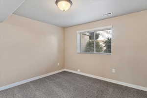 Unfurnished room featuring carpet floors