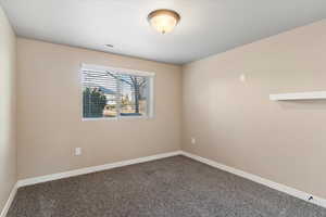 Spare room featuring carpet floors