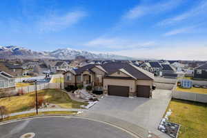 View of front facade featuring a mountain view and a garage