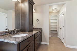 Bathroom featuring tile patterned flooring and vanity