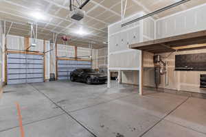 Garage featuring a garage door opener