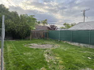 View of yard featuring fence