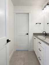 Upstairs Bathroom with 2 sinks in vanity and shower/tub and toilet in separate room for functionality.