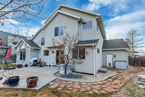 Rear view of property featuring a patio