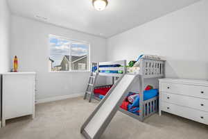 Bedroom with light carpet