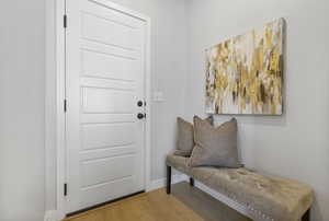 Foyer with wood-type flooring