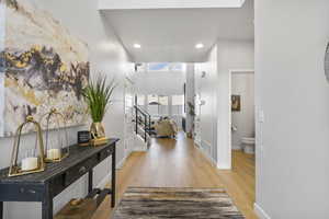 Corridor with light hardwood / wood-style floors