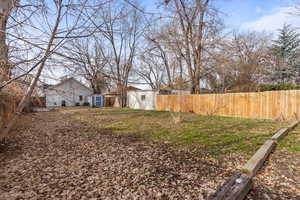 View of yard featuring a shed