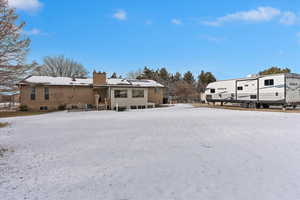 View of snow covered property