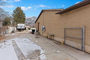 View of snowy exterior featuring a mountain view