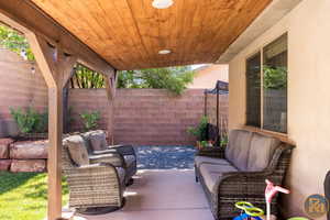 View of patio with an outdoor living space