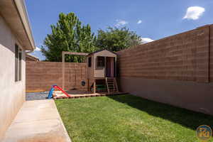 View of yard with a storage unit