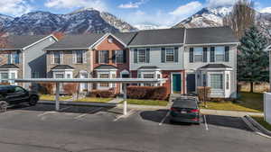 Townhome / multi-family property with a mountain view