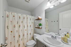 Bathroom with vanity and toilet