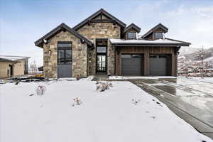 View of front facade featuring a garage