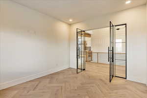 Spare room with light parquet floors