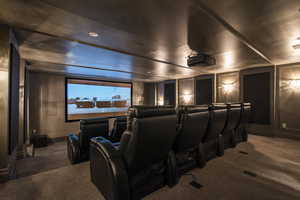 Cinema room featuring carpet floors