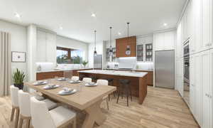 Kitchen with decorative backsplash, pendant lighting, built in appliances, and a kitchen island