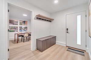 Foyer featuring light hardwood / wood-style flooring