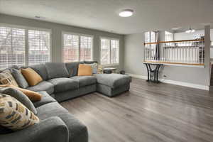 Living room with hardwood / wood-style flooring