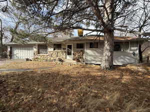 Ranch-style house featuring a garage