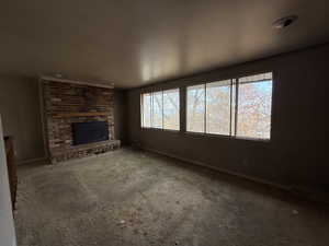 Unfurnished living room with a fireplace