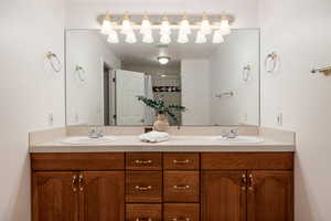 Bathroom featuring a shower with curtain and vanity