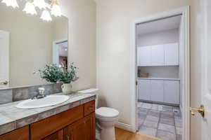 Bathroom with vanity and toilet