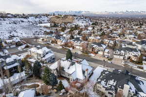 Snowy aerial view featuring a mountain view