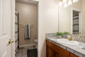 Bathroom with vanity and toilet