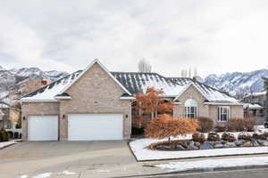 View of front facade featuring a mountain view and a garage