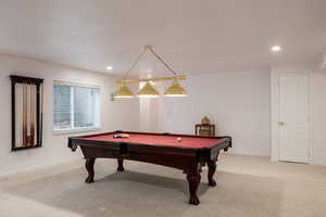 Recreation room with carpet and pool table