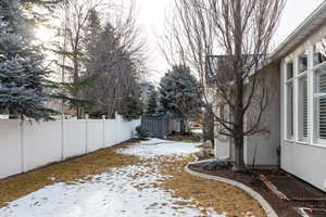 View of yard layered in snow