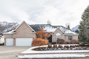 View of front of property featuring a mountain view and a garage