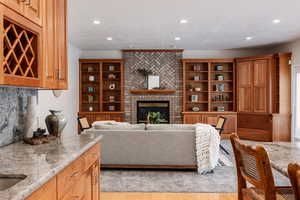 Living room featuring a fireplace and light wood-type flooring