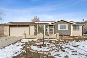 Ranch-style house featuring a garage