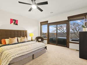 Bedroom with carpet flooring, access to exterior, ceiling fan, and crown molding