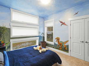 Bedroom with carpet flooring and a closet