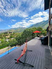 Wooden terrace featuring a mountain view