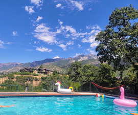 View of pool with a mountain view