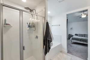 Bathroom with a shower, and tile patterned flooring