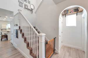 Bright entrance foyer featuring light hardwood / wood-style flooring