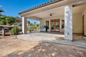 View of patio / terrace featuring ceiling fan, area for grilling, and french doors