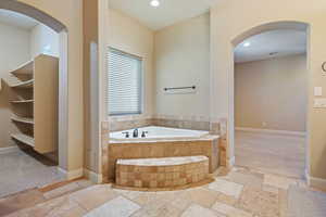 Bathroom with tiled tub