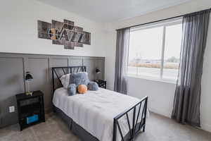 Pics are of model home.Bedroom featuring carpet