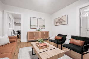 Living room with light hardwood / wood-style flooring