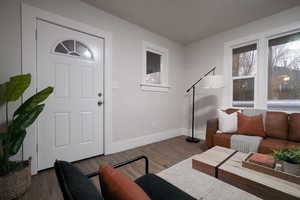 Living room featuring dark hardwood / wood-style floors