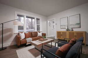 Living room with wood-type flooring