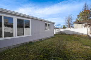 View of home's exterior featuring a yard